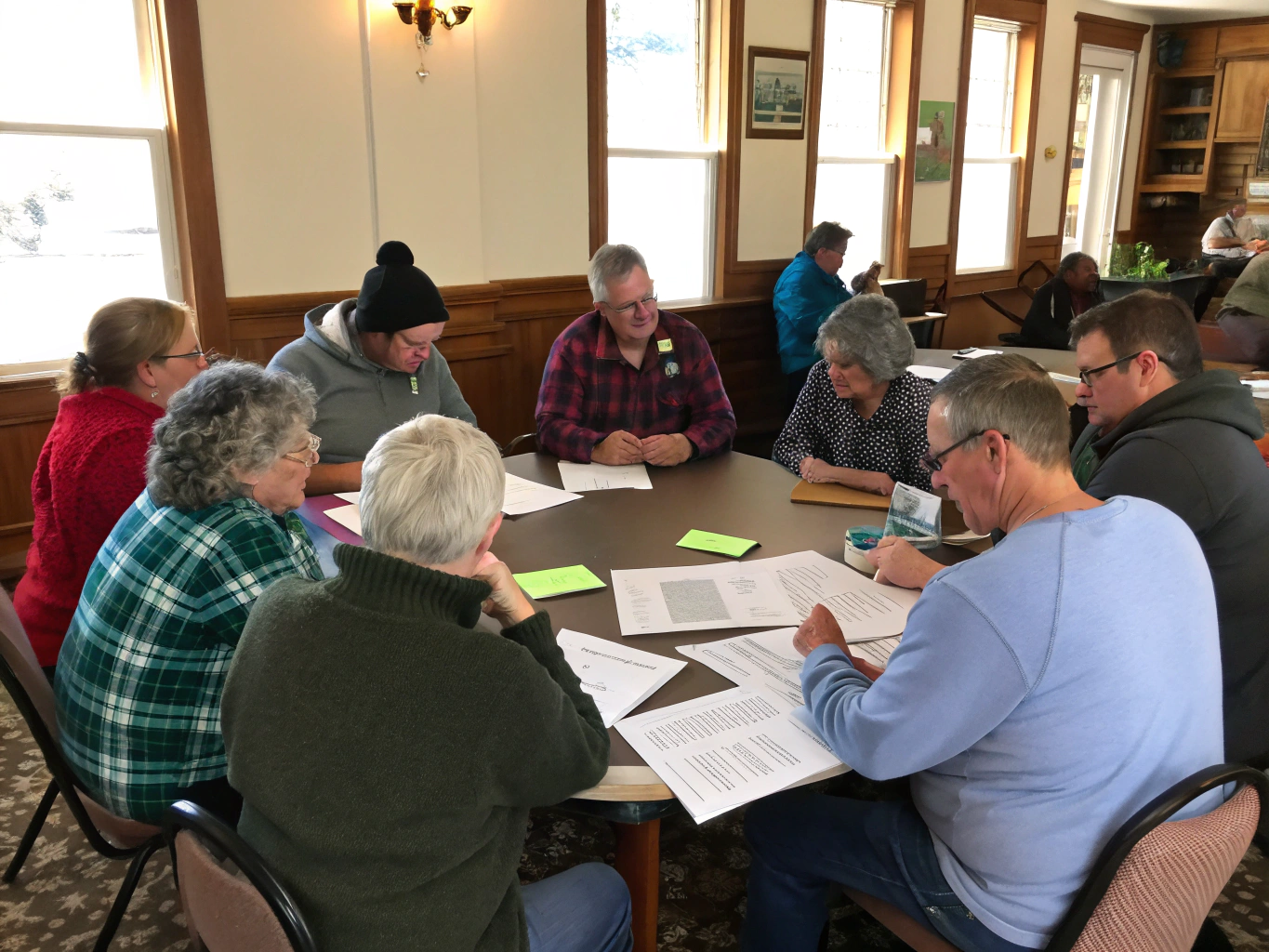 Diverse community members engaging in a town hall discussion